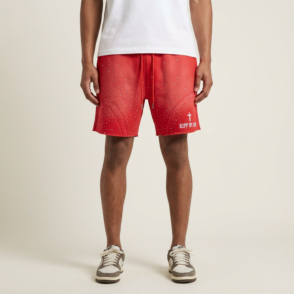 Person wearing red shorts with a white RBG logo on a beige background